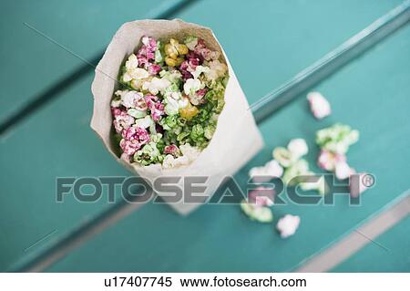 Stock Photography - High angle view of popcorn in a paper bag. Fotosearch