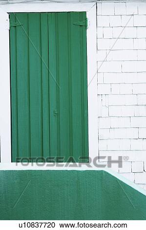 Low angle view of a closed door of a building View Large Photo Image Stock Image - Low angle view of a closed door of a building. Fotosearch