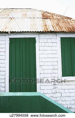 Stock Photo - Low angle view of a closed door of a house. Fotosearch