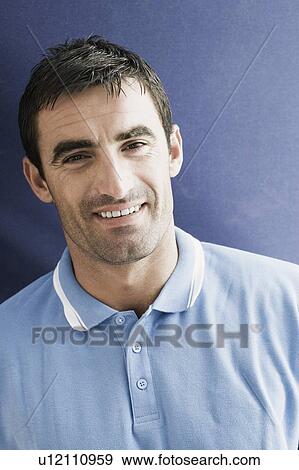 Portrait of a mid adult man smiling View Large Photo Image Stock Photo - Portrait of a mid adult man smiling. Fotosearch