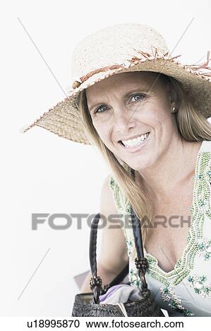 Stock Image - Portrait of a mid adult woman smiling. Fotosearch