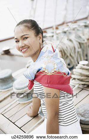 Stock Photograph - Portrait of a young woman smiling. Fotosearch