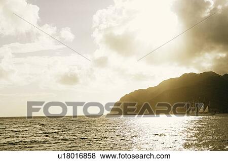 Sailboat in the sea View Large Photo Image Stock Photo - Sailboat in the sea. Fotosearch