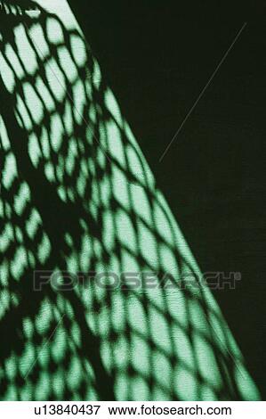 Shadow of a net on the wall View Large Photo Image Stock Photo - Shadow of a net on the wall. Fotosearch
