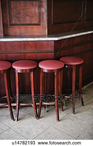 Stools in a row at a bar counter View Large Photo Image Stock Image - Stools in a row at a bar counter. Fotosearch