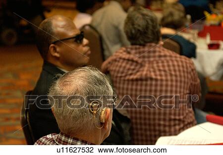 Stock Image - People with disabilities -- from blindness to deafness -- participating in community events and activities.. Fotosearch