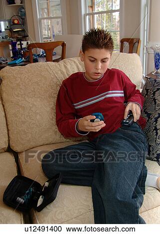 Young boy shows his insulin testing kit. View Large Photo Image Stock Image - Young boy shows his insulin testing kit.. Fotosearch