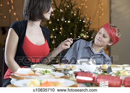 A boy refusing to eat a Brussels sprout View Large Photo Image Stock Image - A boy refusing to eat a Brussels sprout. Fotosearch