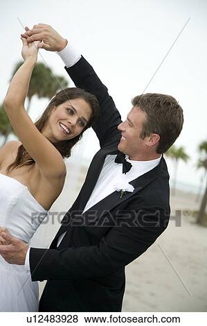 Stock Photo - A bride and groom dancing. Fotosearch