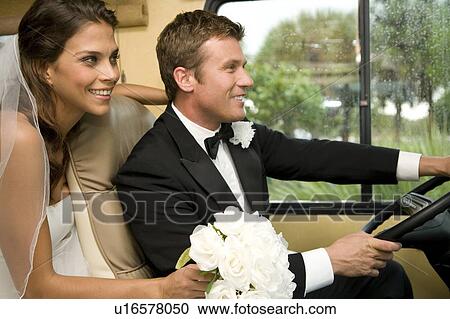 A bride and groom in a car View Large Photo Image Stock Image - A bride and groom in a car. Fotosearch