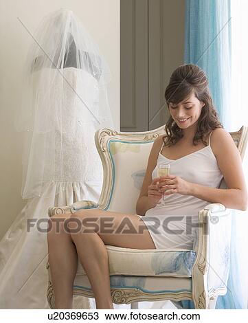 A bride drinking champagne View Large Photo Image Stock Image - A bride drinking champagne. Fotosearch