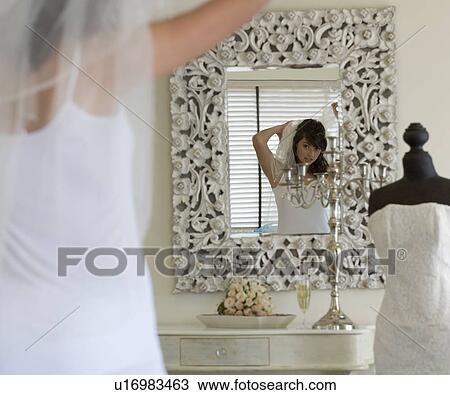 Stock Image - A bride getting ready for her wedding. Fotosearch