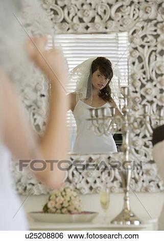 Stock Photograph - A bride getting ready for her wedding. Fotosearch