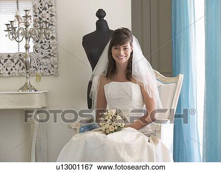 A bride sitting on a chair View Large Photo Image Stock Photo - A bride sitting on a chair. Fotosearch