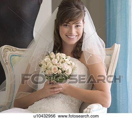 A bride sitting on a chair View Large Photo Image Stock Photograph - A bride sitting on a chair. Fotosearch