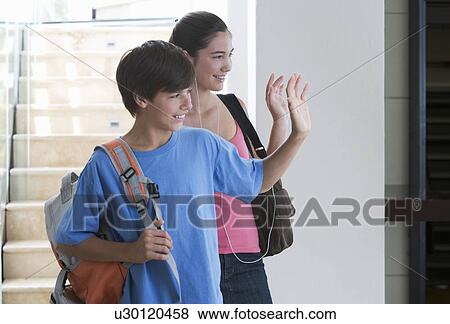 Stock Photo - A brother and sister going to school. Fotosearch