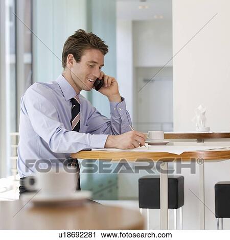 A businessman making a diary appointment View Large Photo Image Stock Image - A businessman making a diary appointment. Fotosearch
