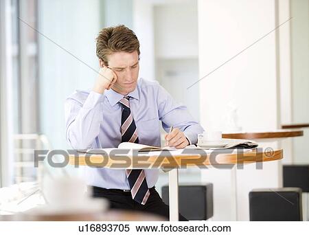 A businessman waiting in a hotel lobby View Large Photo Image Stock Photography - A businessman waiting in a hotel lobby. Fotosearch