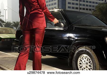 A businesswoman parking her car View Large Photo Image Stock Photo - A businesswoman parking her car. Fotosearch