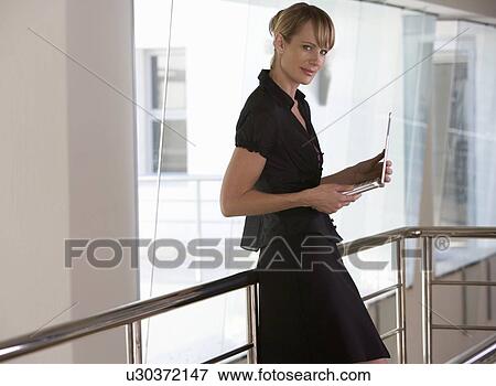 A businesswoman using a laptop View Large Photo Image Stock Photo - A businesswoman using a laptop. Fotosearch