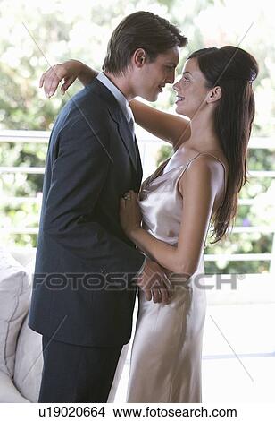 Picture - A couple dressed for an evening out. Fotosearch
