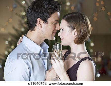 Stock Image - A couple drinking champagne. Fotosearch