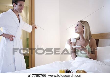 A couple in a hotel bedroom View Large Photo Image Stock Photograph - A couple in a hotel bedroom. Fotosearch