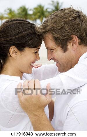 A couple on a beach View Large Photo Image Stock Image - A couple on a beach. Fotosearch
