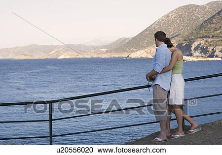 A couple relaxing on holiday View Large Photo Image Stock Image - A couple relaxing on holiday. Fotosearch
