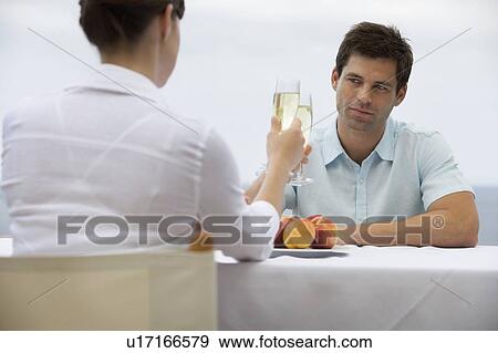 Stock Photo - A couple sharing a romantic meal. Fotosearch