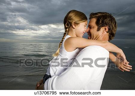 A father and daughter on a beach View Large Photo Image Stock Photography - A father and daughter on a beach. Fotosearch