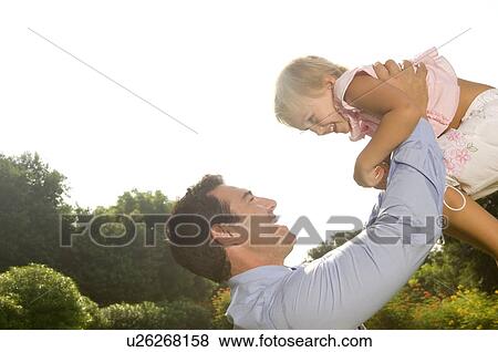 Stock Photo - A father with his young daughter. Fotosearch