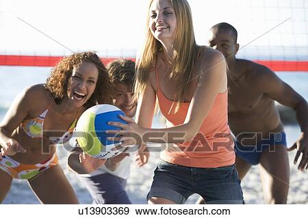 A game of beach volleyball View Large Photo Image Stock Photo - A game of beach volleyball. Fotosearch