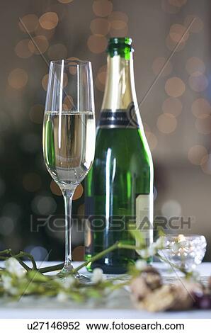 A glass of champagne and mistletoe View Large Photo Image Stock Image - A glass of champagne and mistletoe. Fotosearch
