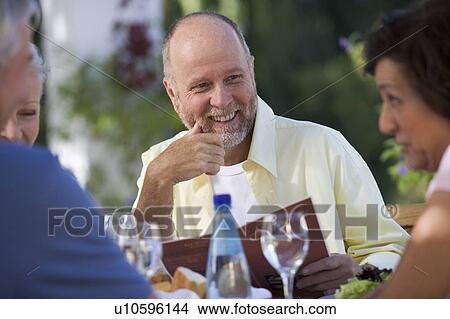A group of senior couples at a restaurant View Large Photo Image Picture - A group of senior couples at a restaurant. Fotosearch