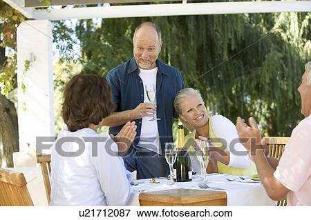 A group of senior couples celebrating View Large Photo Image Stock Photo - A group of senior couples celebrating. Fotosearch