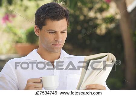 A man reading a book View Large Photo Image Stock Photograph - A man reading a book. Fotosearch