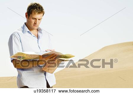 Stock Photo - A man reading a map. Fotosearch
