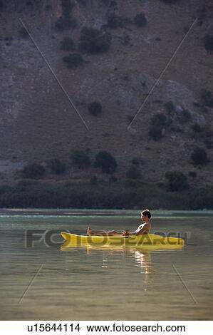 A man relaxing in a canoe View Large Photo Image Picture - A man relaxing in a canoe. Fotosearch