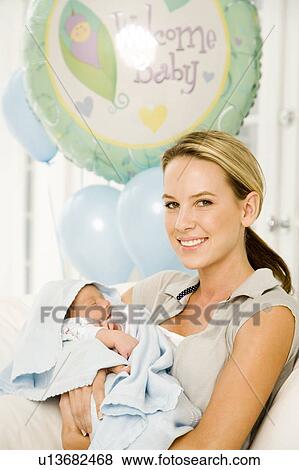 A mother and her new baby View Large Photo Image Stock Photo - A mother and her new baby. Fotosearch