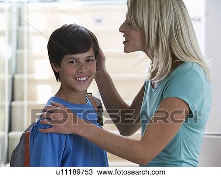 Stock Image - A mother saying goodbye to her son. Fotosearch