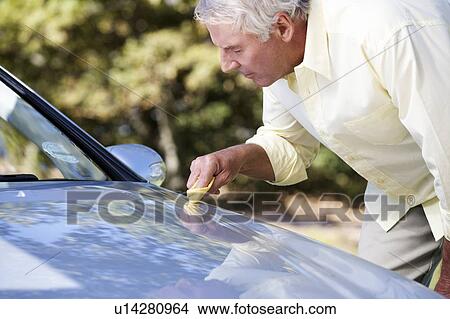 A senior man cleaning his car View Large Photo Image Picture - A senior man cleaning his car. Fotosearch