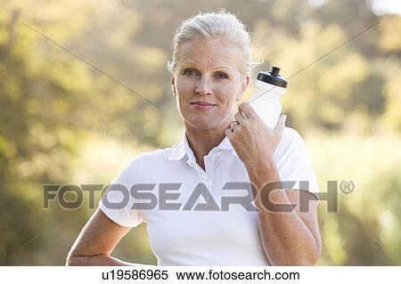 A senior woman keeping fit View Large Photo Image Stock Photography - A senior woman keeping fit. Fotosearch