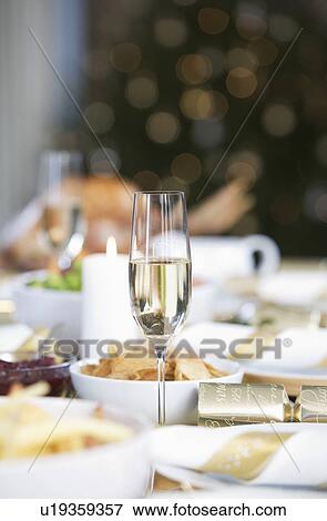 Stock Photo - A table set for Christmas dinner. Fotosearch