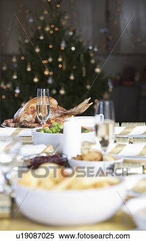 A table set for Christmas dinner View Large Photo Image Stock Photography - A table set for Christmas dinner. Fotosearch