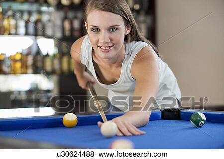 A teenage girl playing pool View Large Photo Image Stock Photo - A teenage girl playing pool. Fotosearch