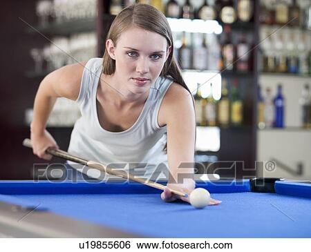 A teenage girl playing pool View Large Photo Image Stock Photograph - A teenage girl playing pool. Fotosearch