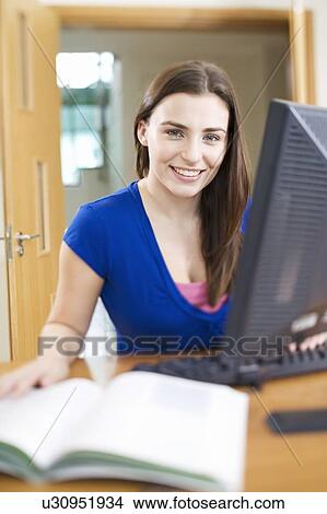 A teenage girl using a computer View Large Photo Image Picture - A teenage girl using a computer. Fotosearch