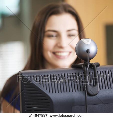A teenage girl using a computer View Large Photo Image Stock Photo - A teenage girl using a computer. Fotosearch