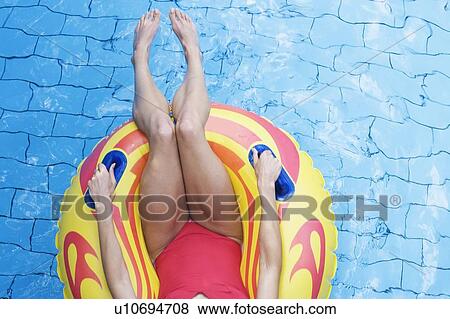 A woman having fun in a waterpark View Large Photo Image Stock Photo - A woman having fun in a waterpark. Fotosearch